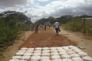 watering-murrram-before-laying-of-gunny-bags---Iftin-Garissa-County