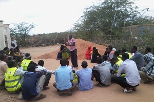 CORE-Kenya-Engineer-giving-instructions-to-youth-ahead-of-project-implementation-in-Waberi---garissa-County